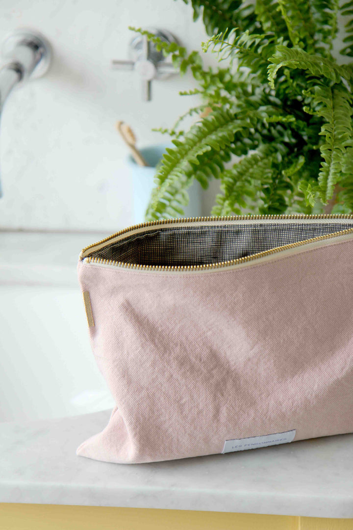les pensionnaires pink toiletry bag in yellow bathroom