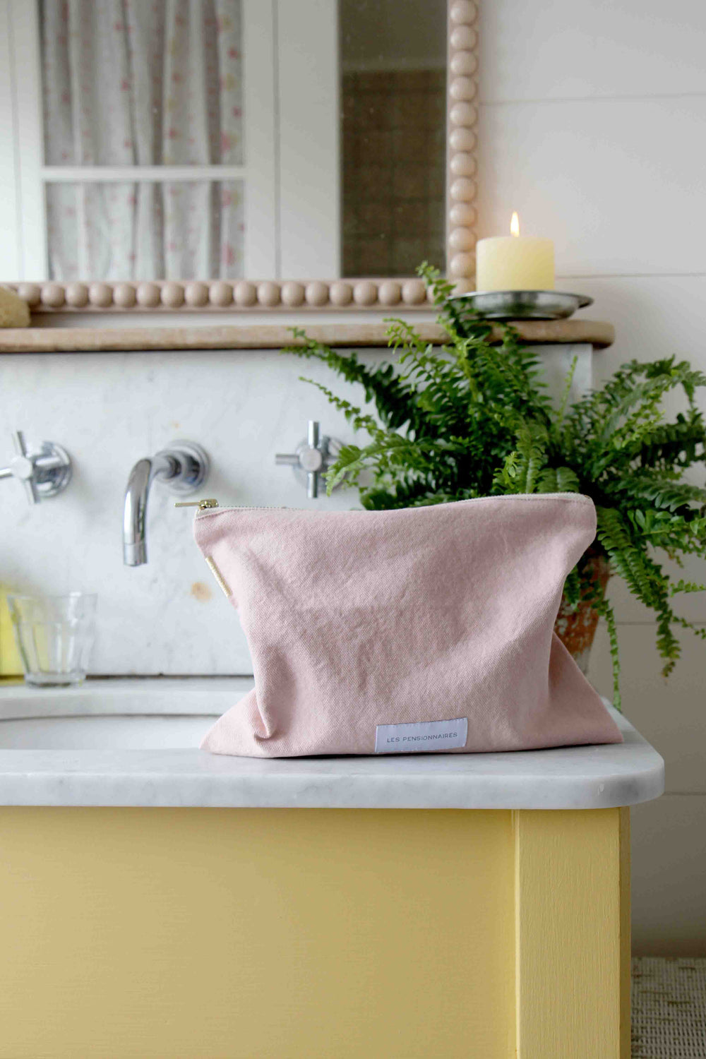 les pensionnaires pink toiletry bag in yellow bathroom 1