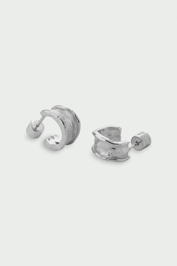 Pair of silver hoop earrings on a white background