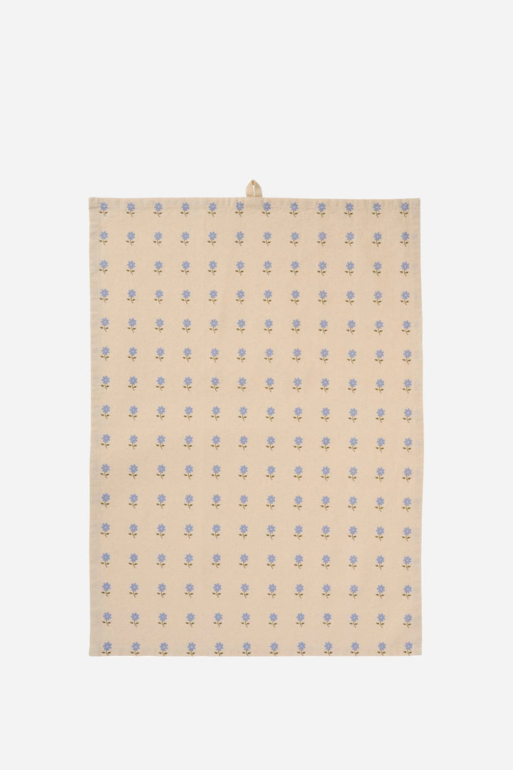 Beige fabric with blue floral pattern on a white background