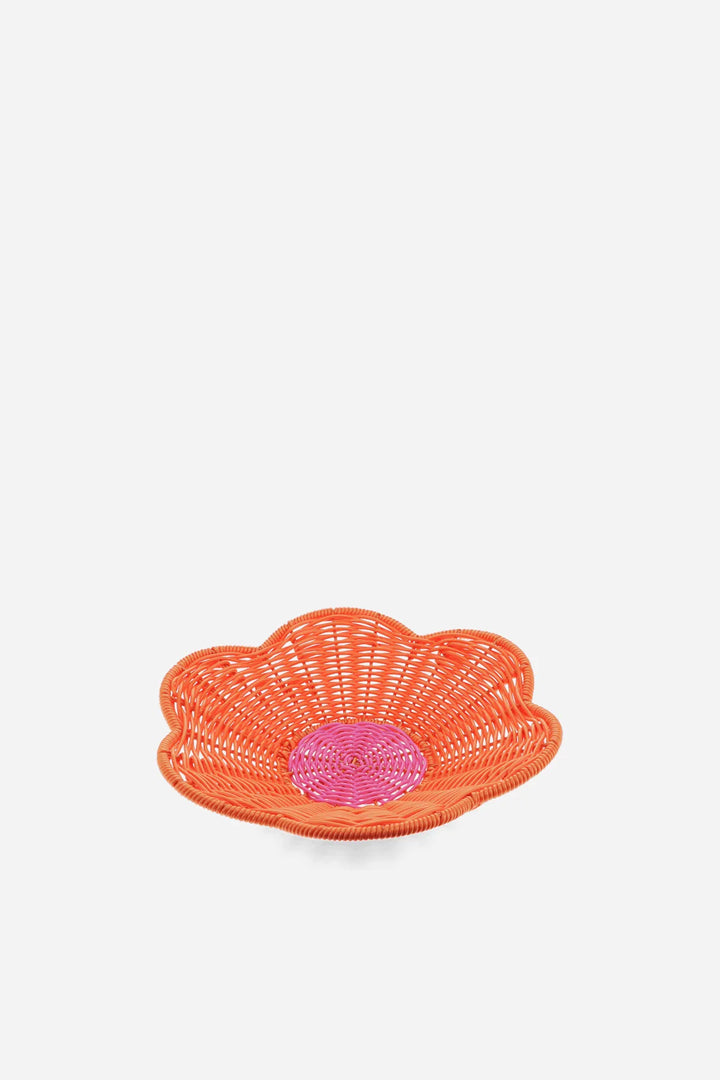 Orange woven basket with a pink center on a white background