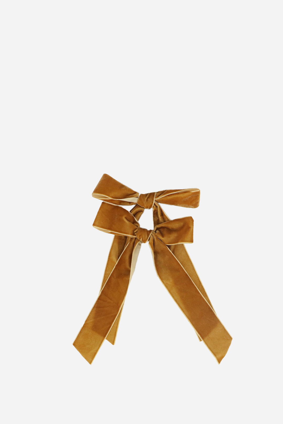 Gold velvet bow on a white background