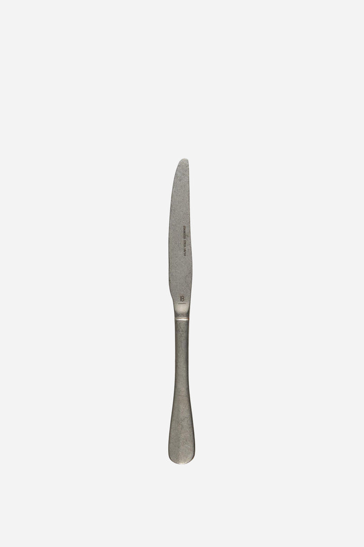 Silver knife on a white background