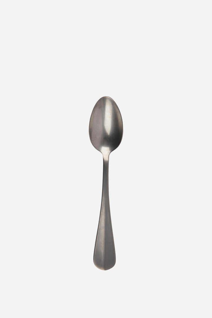 Silver spoon on a white background