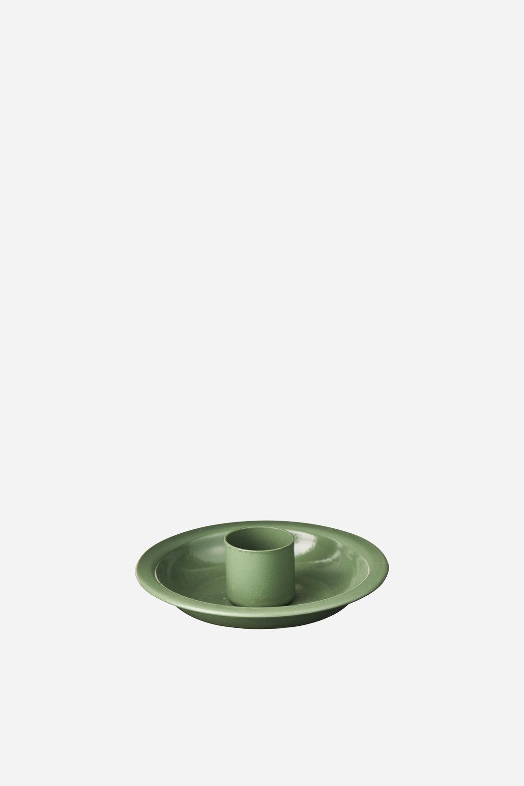 Green enamel candle holder on a white background