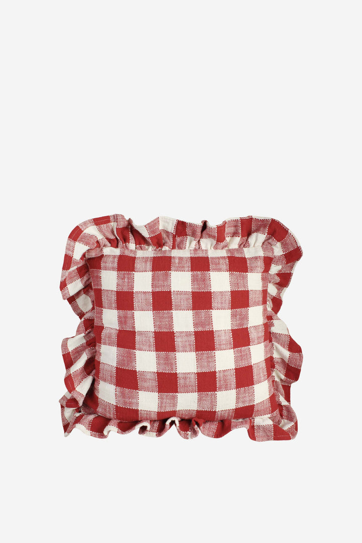 Red and white checkered pillow with ruffled edges on a white background