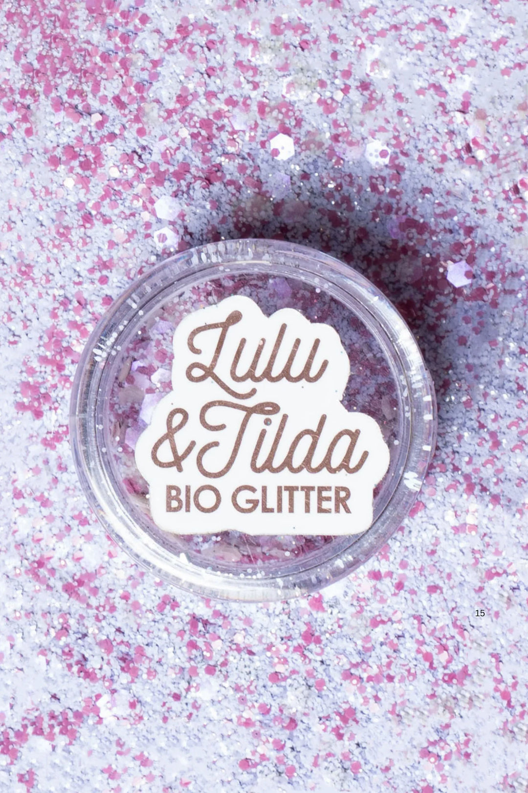 Lulu &amp; Tilda BIO GLITTER container on a pink glittery background