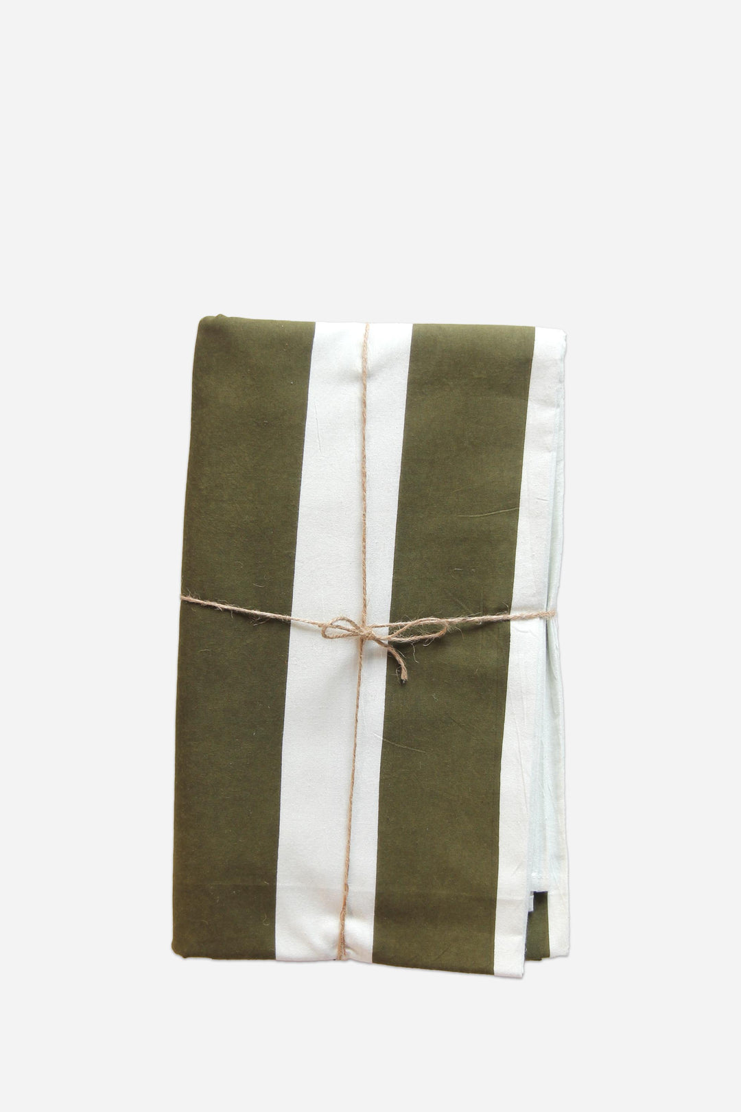 Green and white striped towel tied with twine on a light gray background
