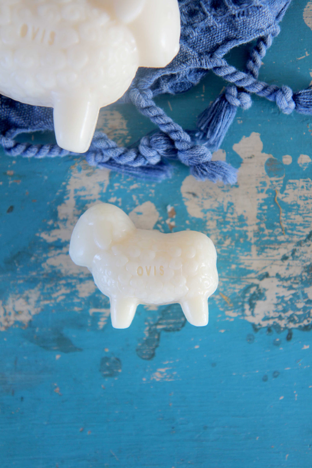 lamb shaped sheeps milk soap on blue background