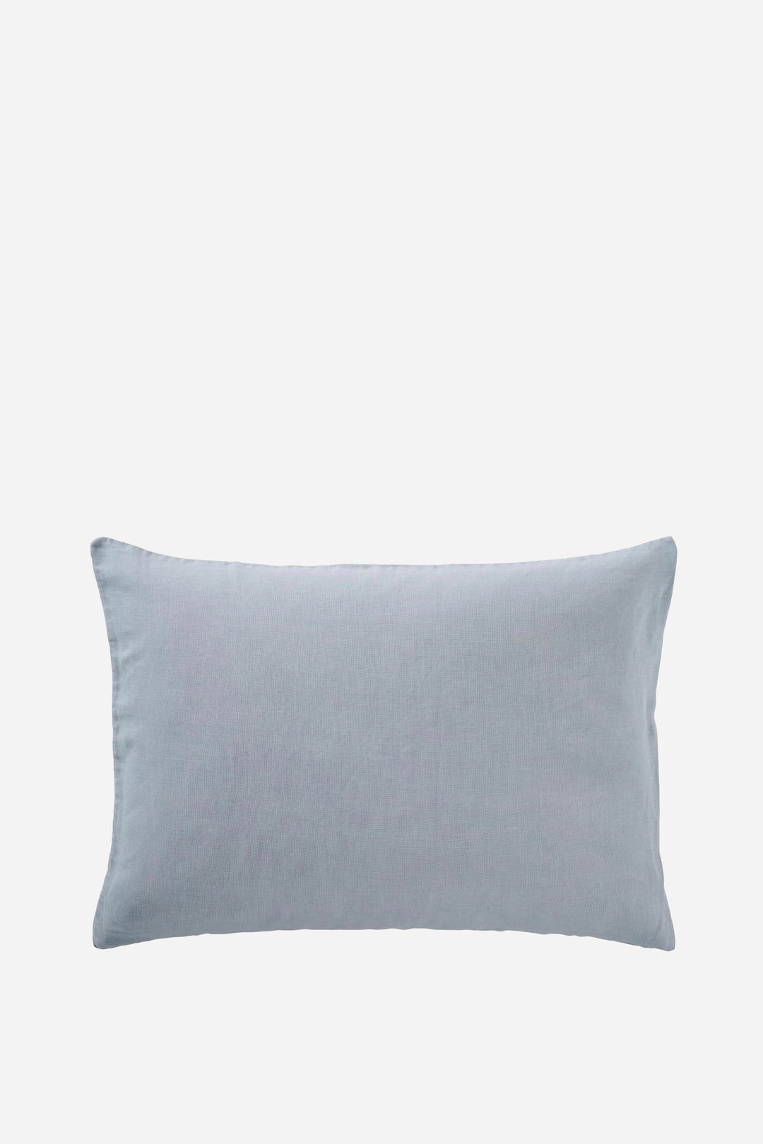 cornflower blue pillow on a light gray background