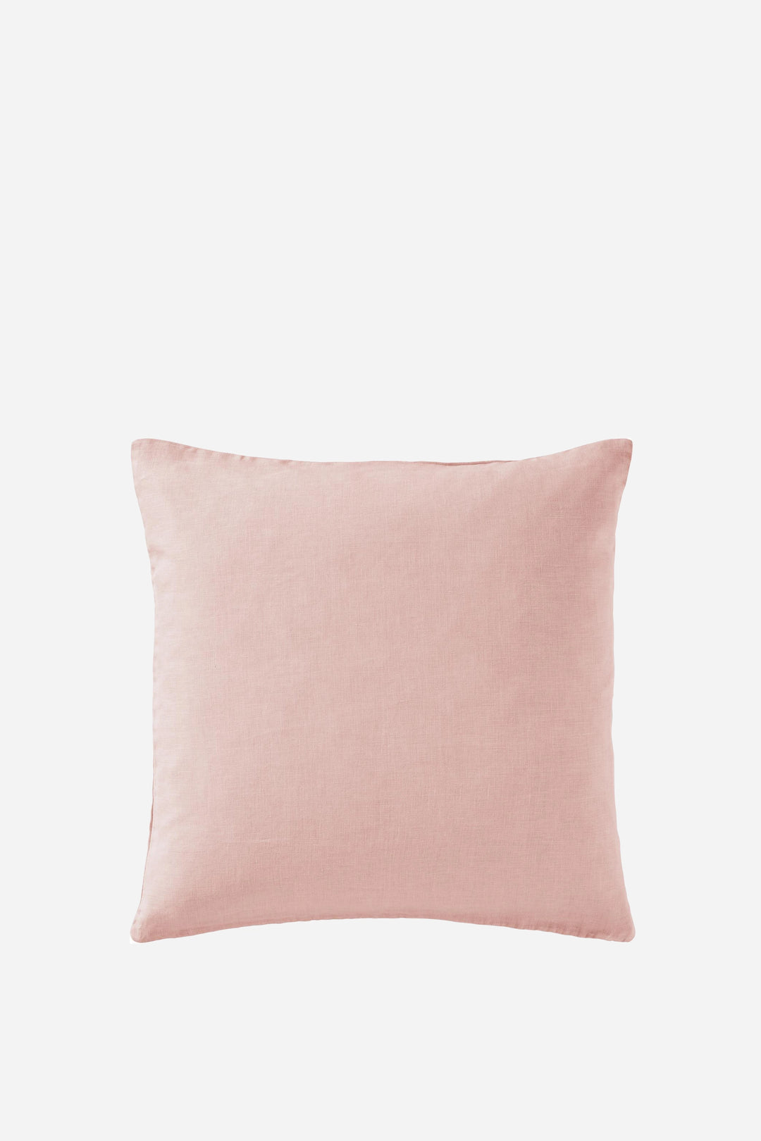 pale pink linen cushion on white background
