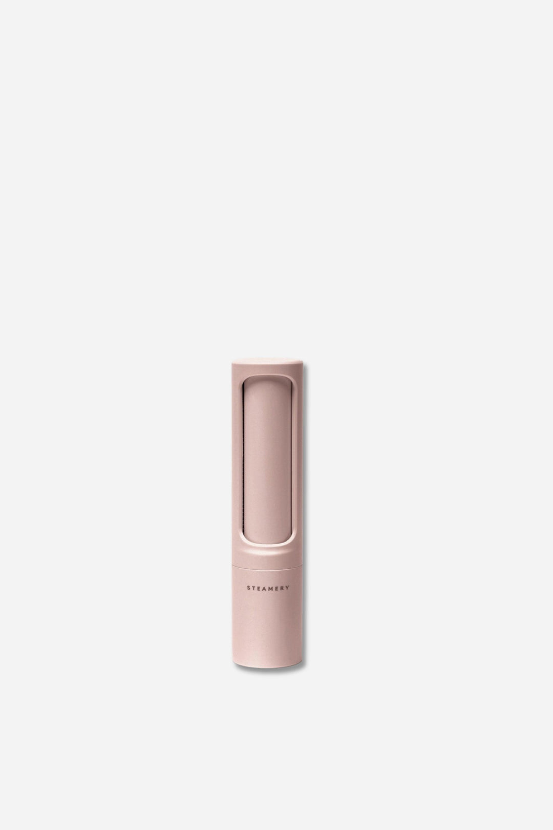 Pink handheld lint roller on a white background