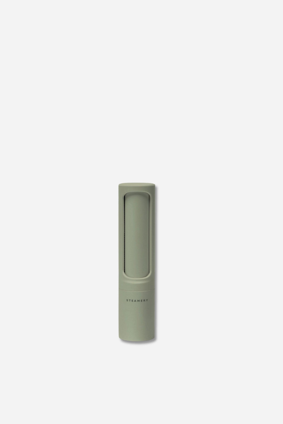 Green cylindrical lint roller in sage green by the steamery