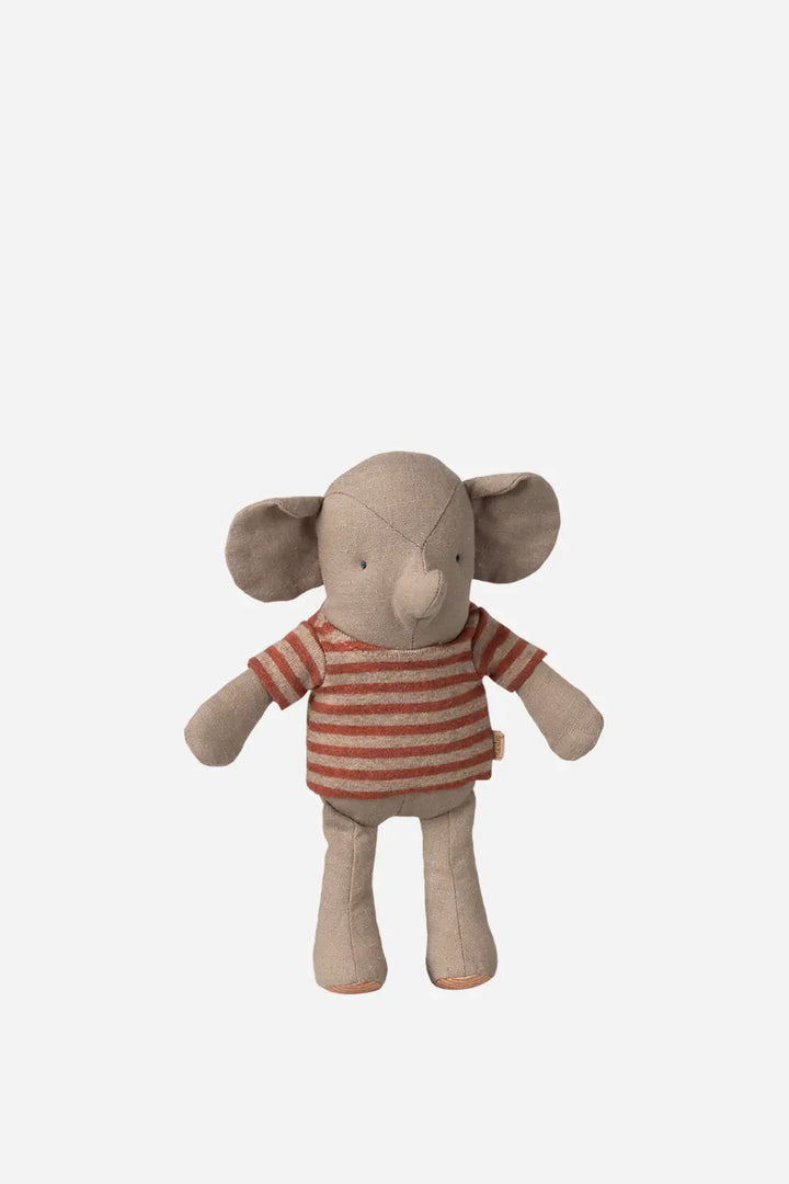 Stuffed toy elephant wearing a red and white striped shirt on a light gray background