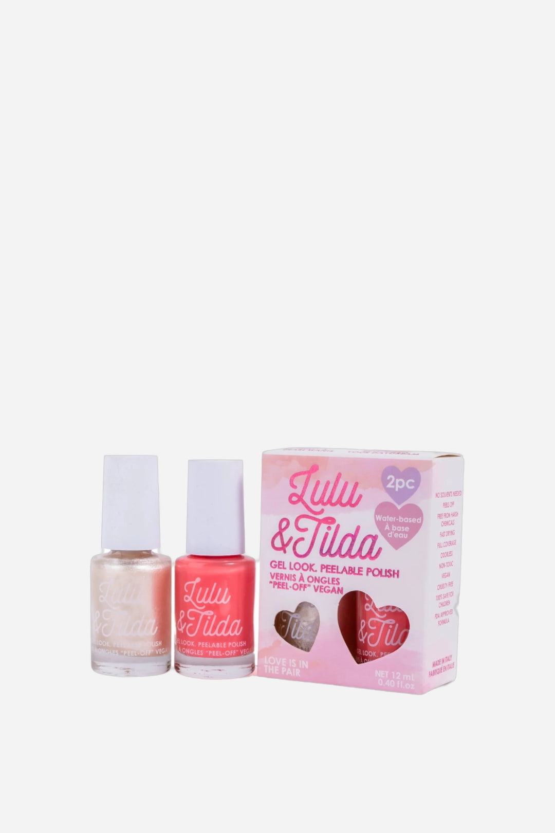 Lulu &amp; Tilda nail polish set featuring two bottles of nail polish (one champagne gold, one coral pink) and their pink packaging box on a light gray background.