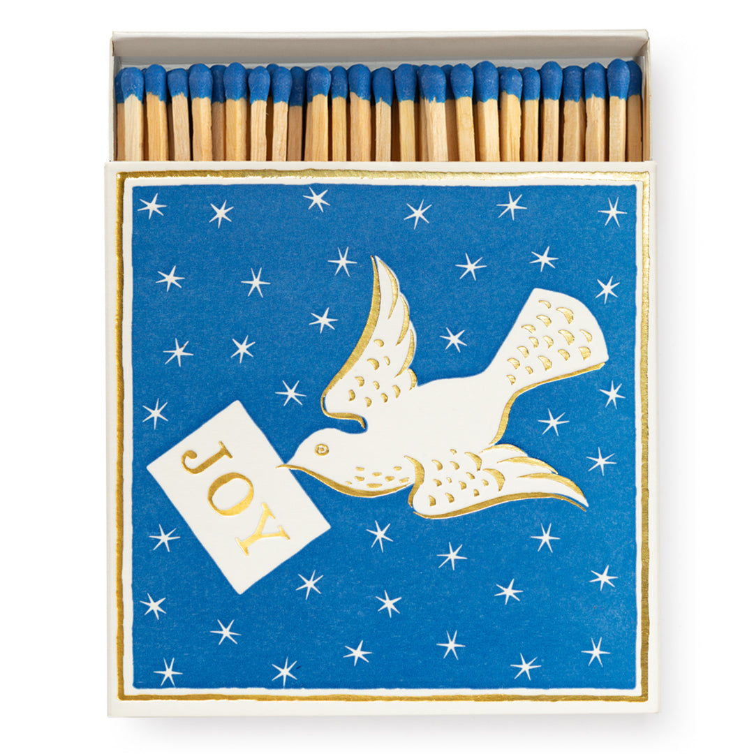 box of luxury matches featuring the christmas dove design of Ariana Martin