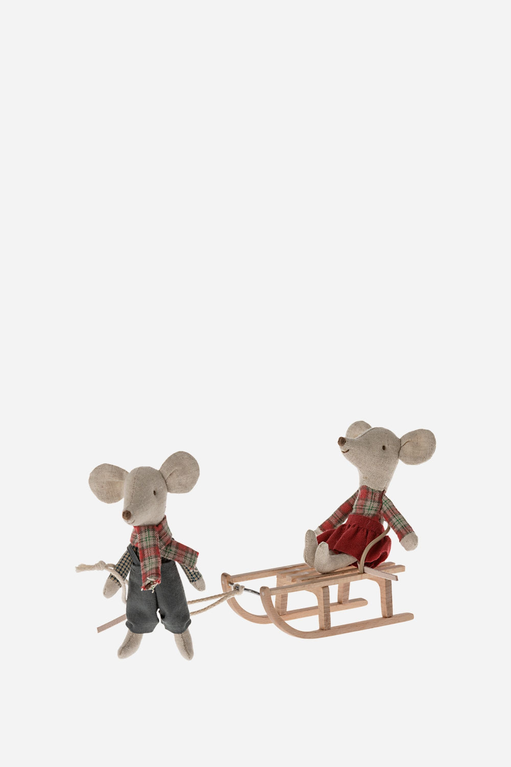 Two toy mice with a sled on a white background