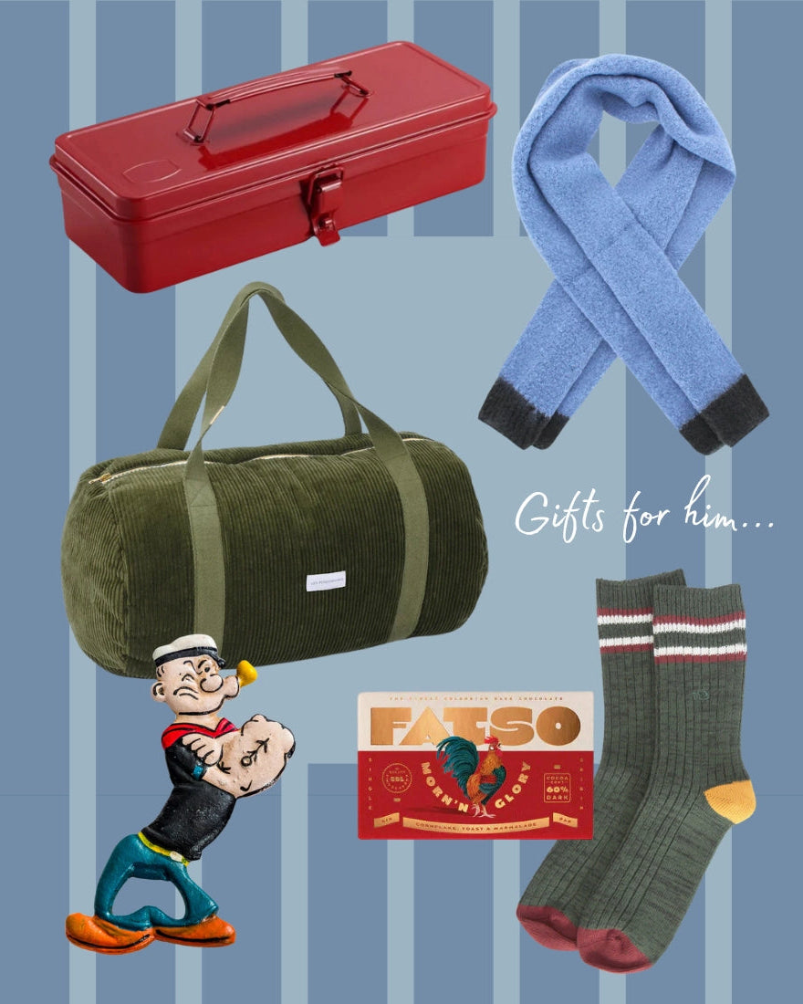 Collection of gifts for him including a red toolbox, green duffel bag, blue scarf, socks, and a cartoon character on a striped background.