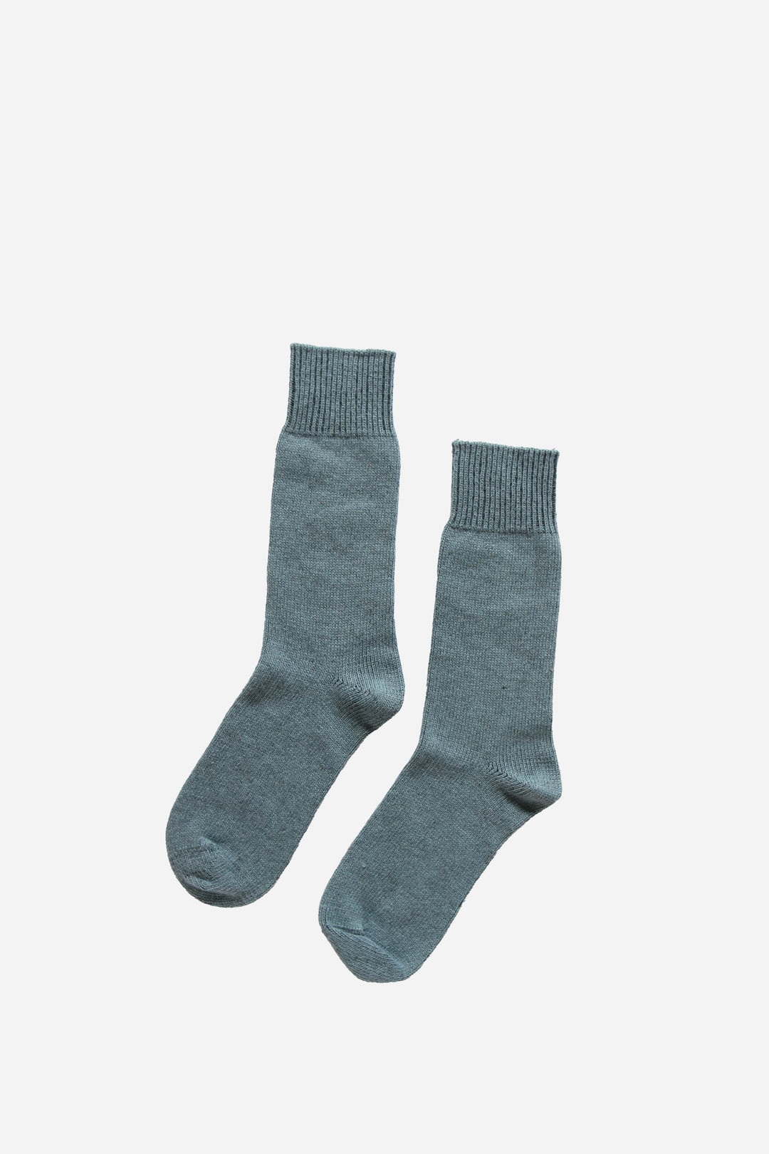 plain blue mens socks on white background