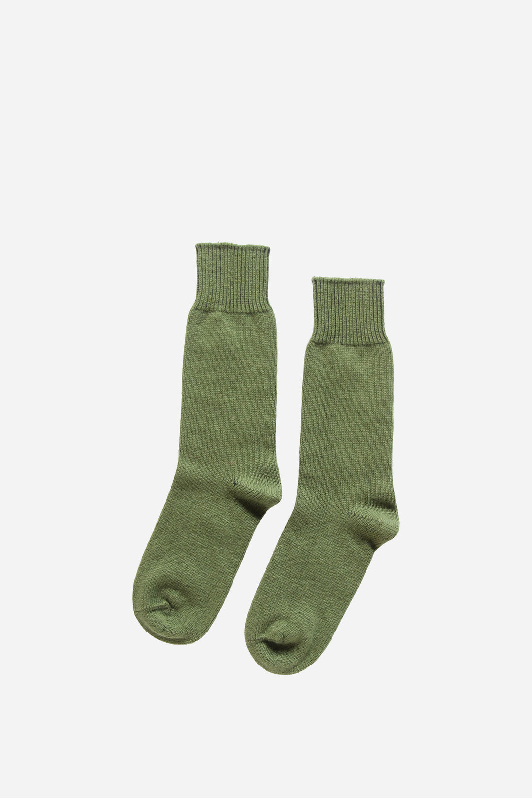 Pair of green socks on a white background