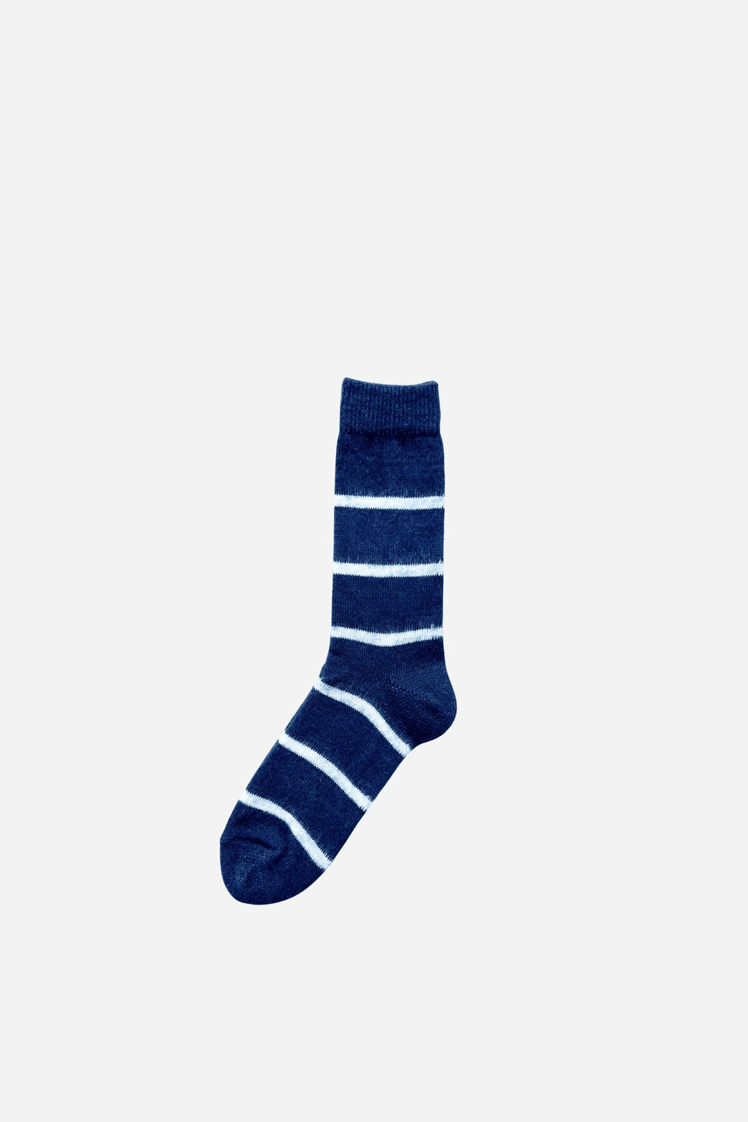 Navy blue sock with white stripes on a light gray background