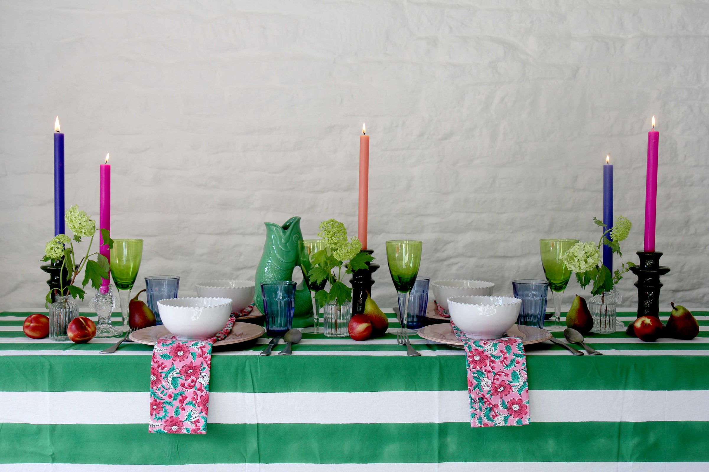 mothers day tablescape with block print napkins, colourful candles and striped table cloth