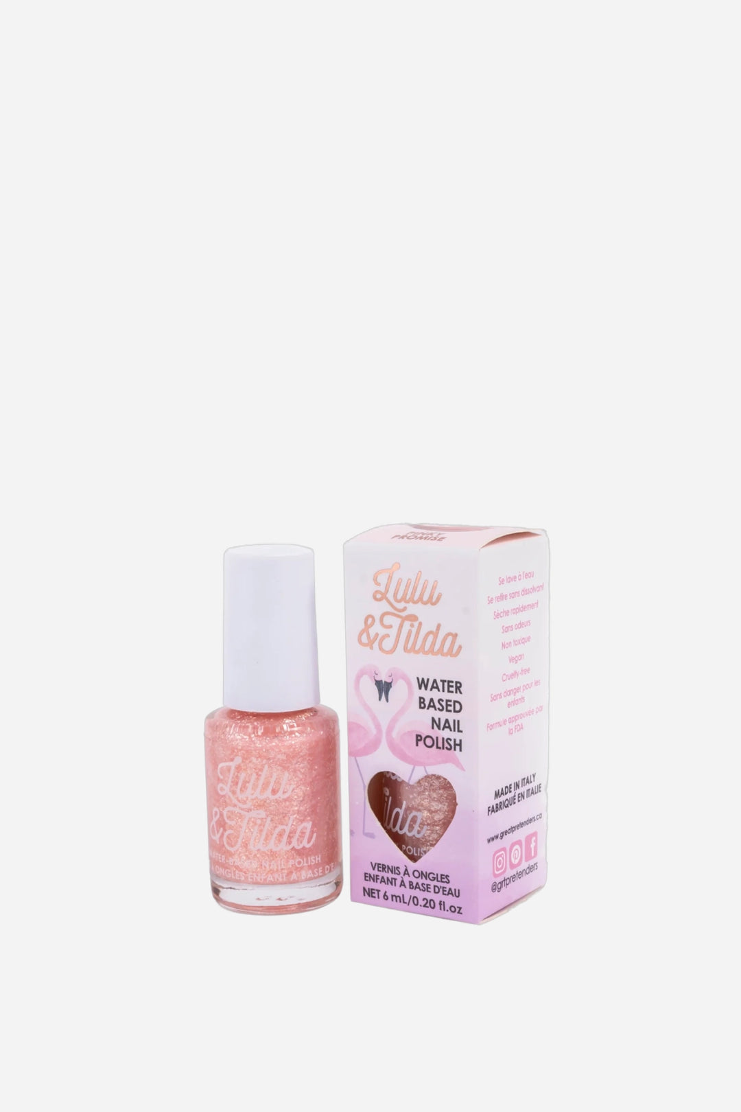 A bottle of Lulu & Tilda water-based nail polish in a sparkling pink shade, shown next to its pink packaging box on a clean white background.