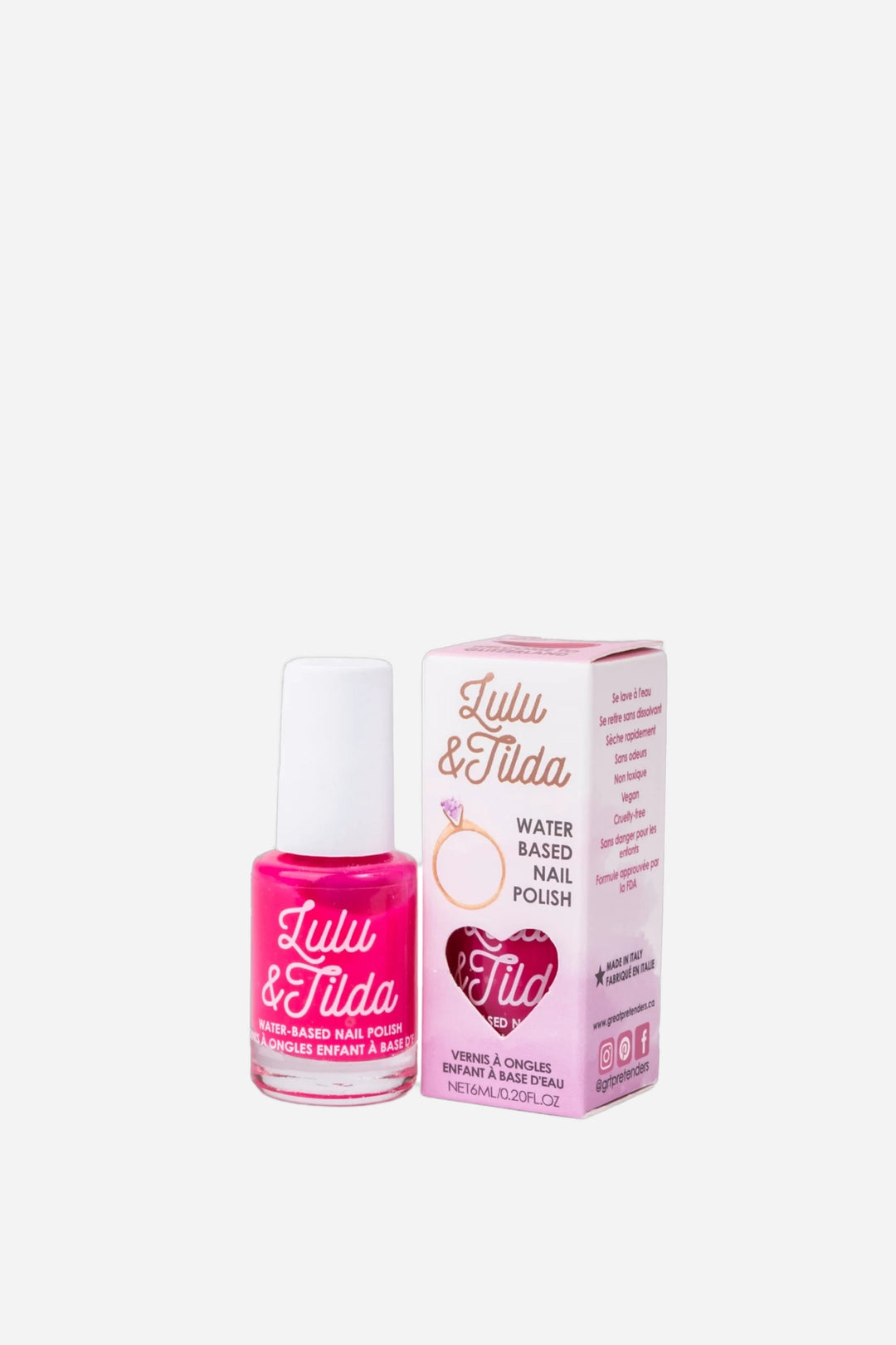 A bottle of Julli &amp; Tilda pink water-based nail polish next to its pink packaging box, set against a plain white background.