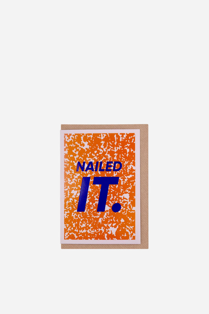 greeting card with 'NAILED IT.' text on a orange background