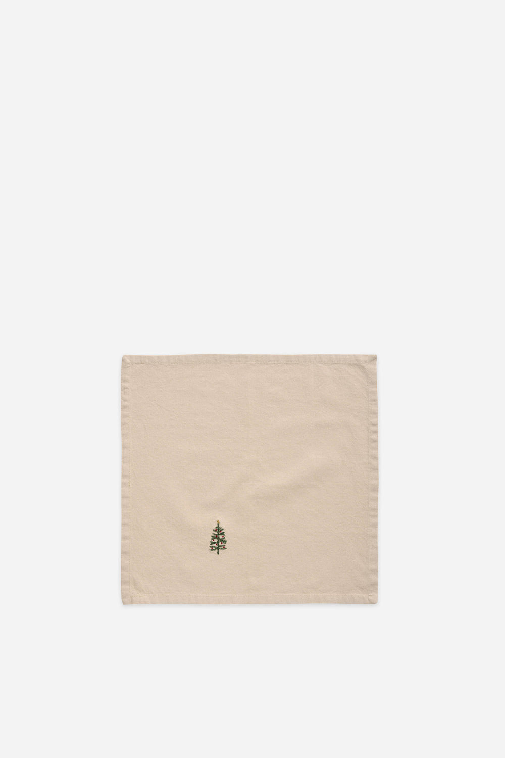 Beige fabric square with a green tree design on a white background
