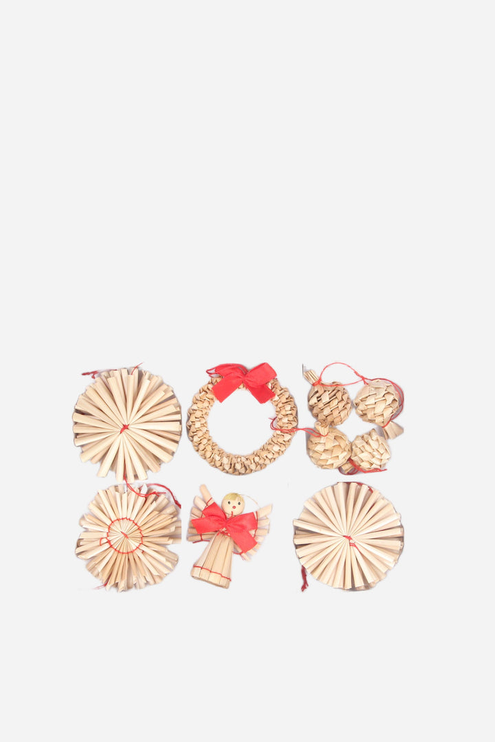 Set of decorative Christmas wreaths and angel figurines on a light gray background