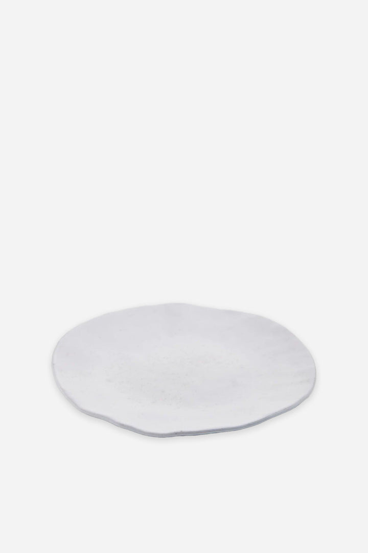 White ceramic plate on a white background