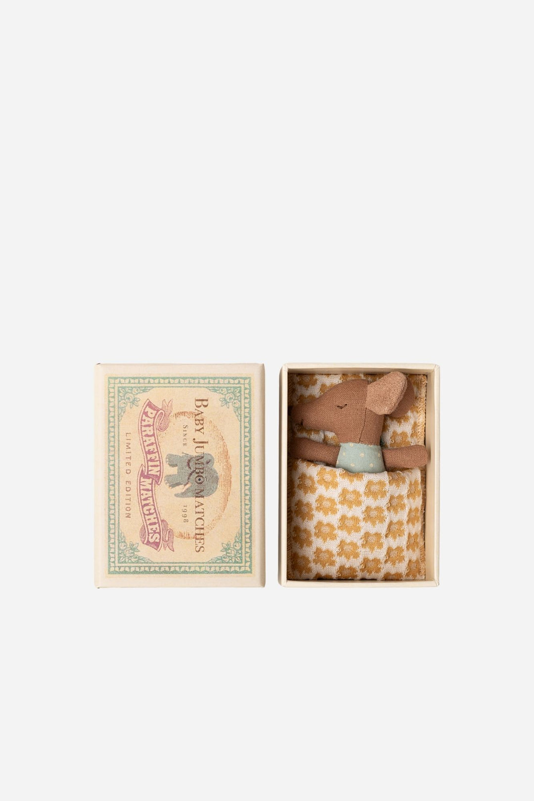 Small brown teddy mouse in a box with a floral pattern, next to a decorative card on a white background.