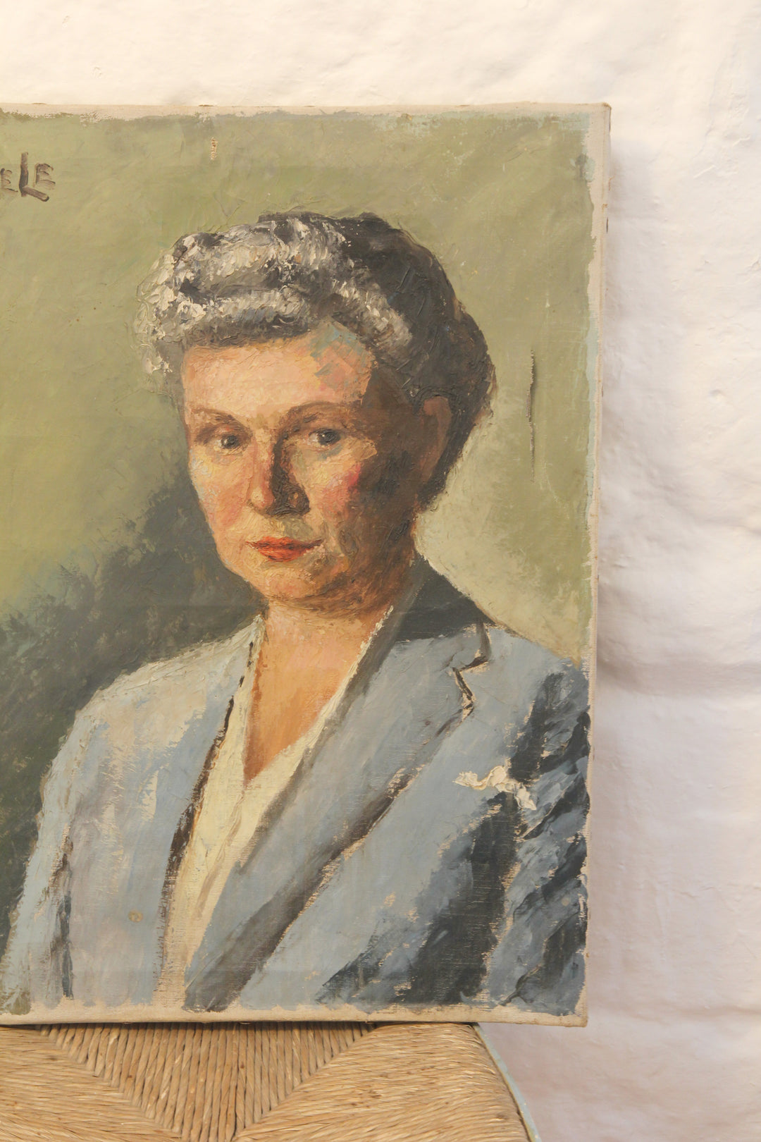 Portrait painting of a woman with a gray hat on a textured surface