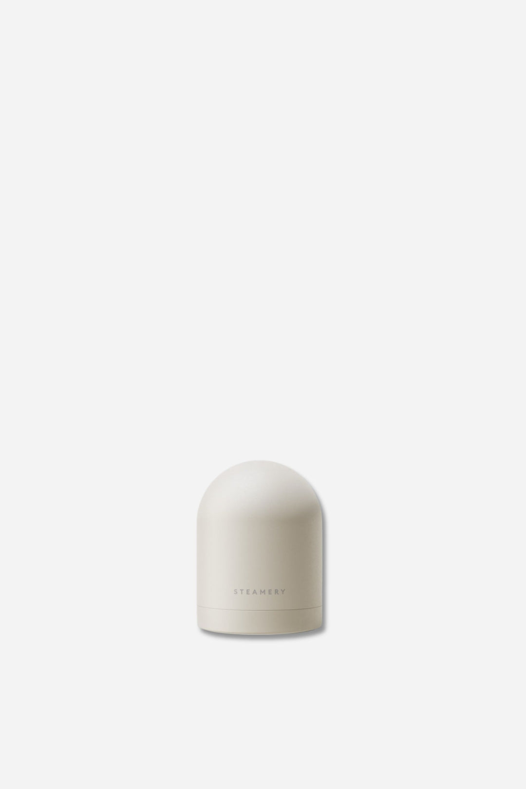 White cylindrical fabric shaver with steamery branding on a white background