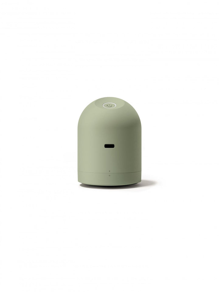 Green fabric shaver on a white background