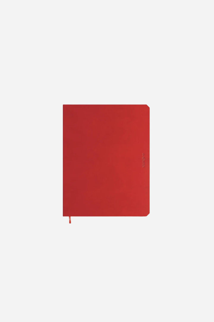 red notebook on white background