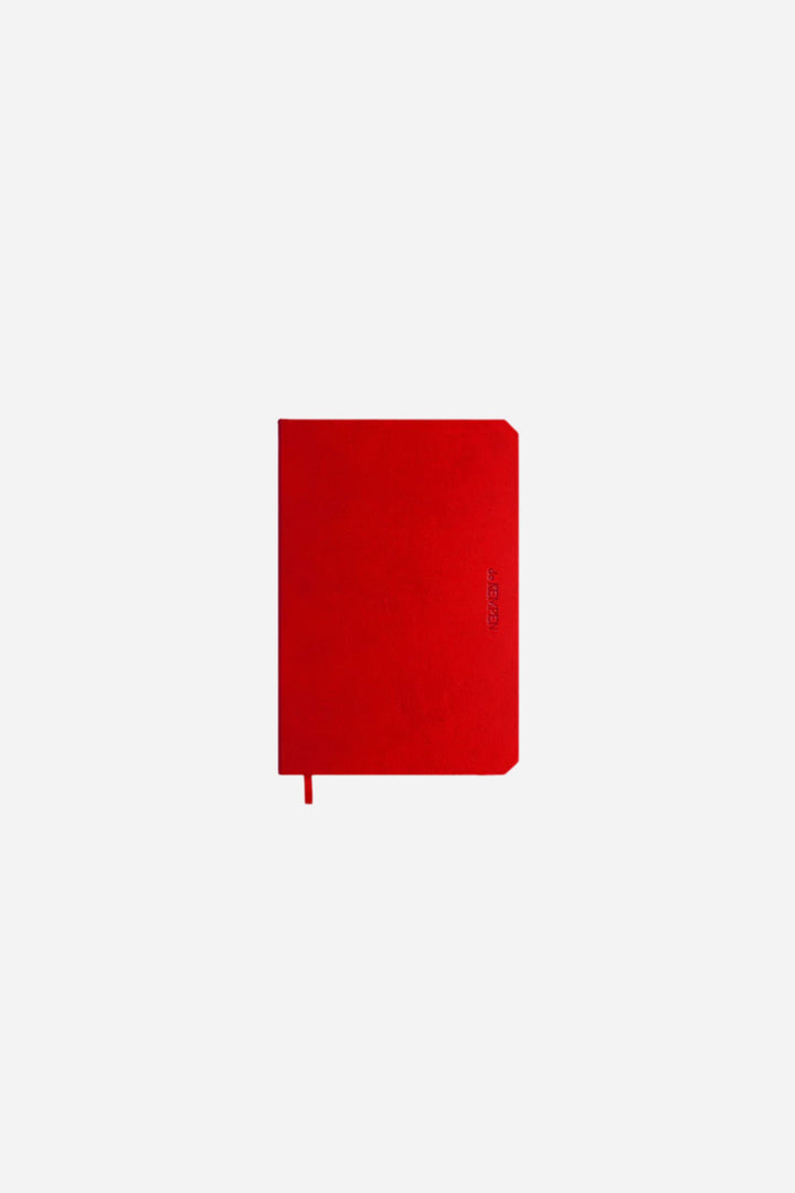 red notebook on white back round