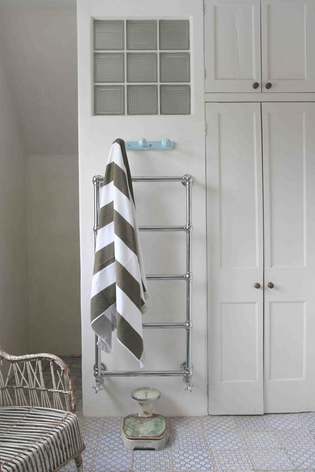 bathroom lifestyle of khaki and white stripe beach towel