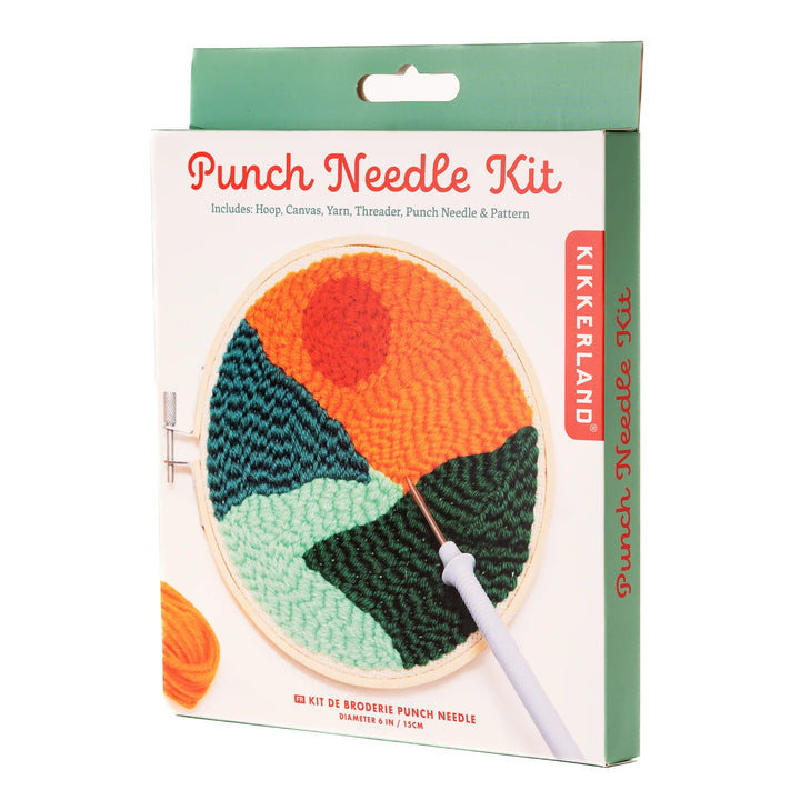 Punch needle kit packaging with colorful needlepoint design and Kikkerland branding.