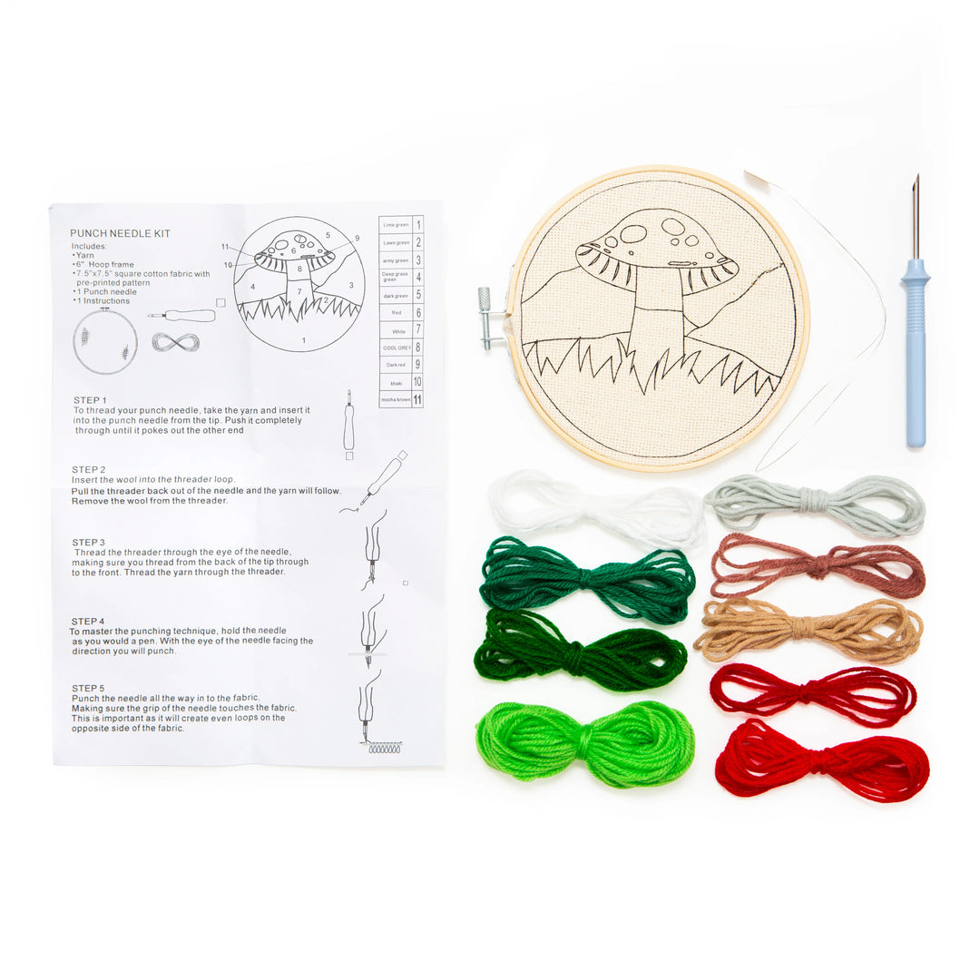 Punch needle kit with embroidery hoop, threads, and instructions on a white background
