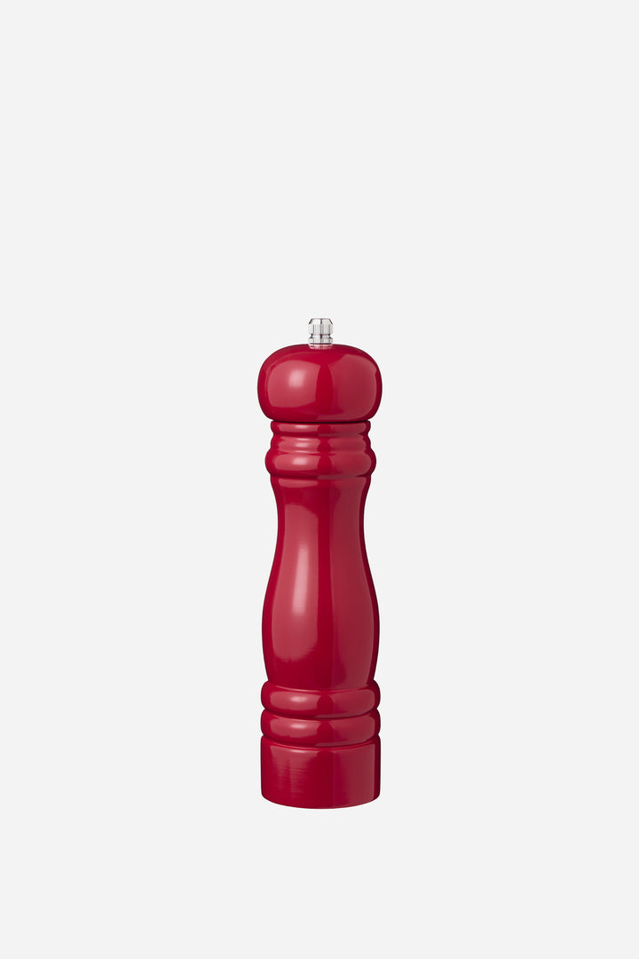 Red pepper grinder on a white background