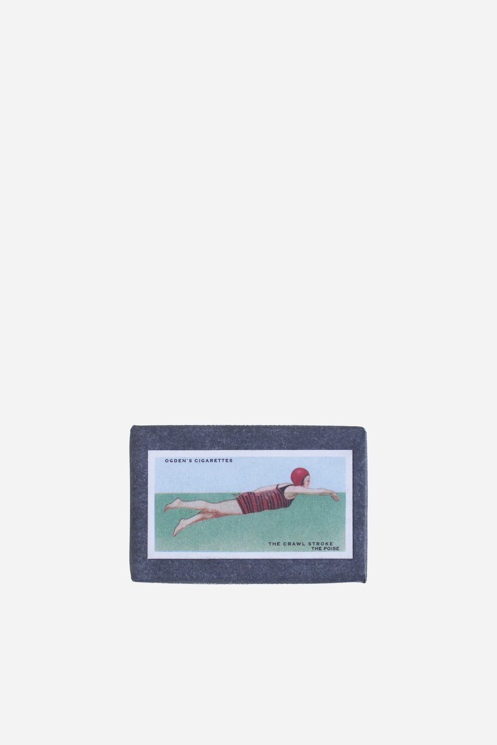 retro olive soap bar with vintage cigarette packaging swimming