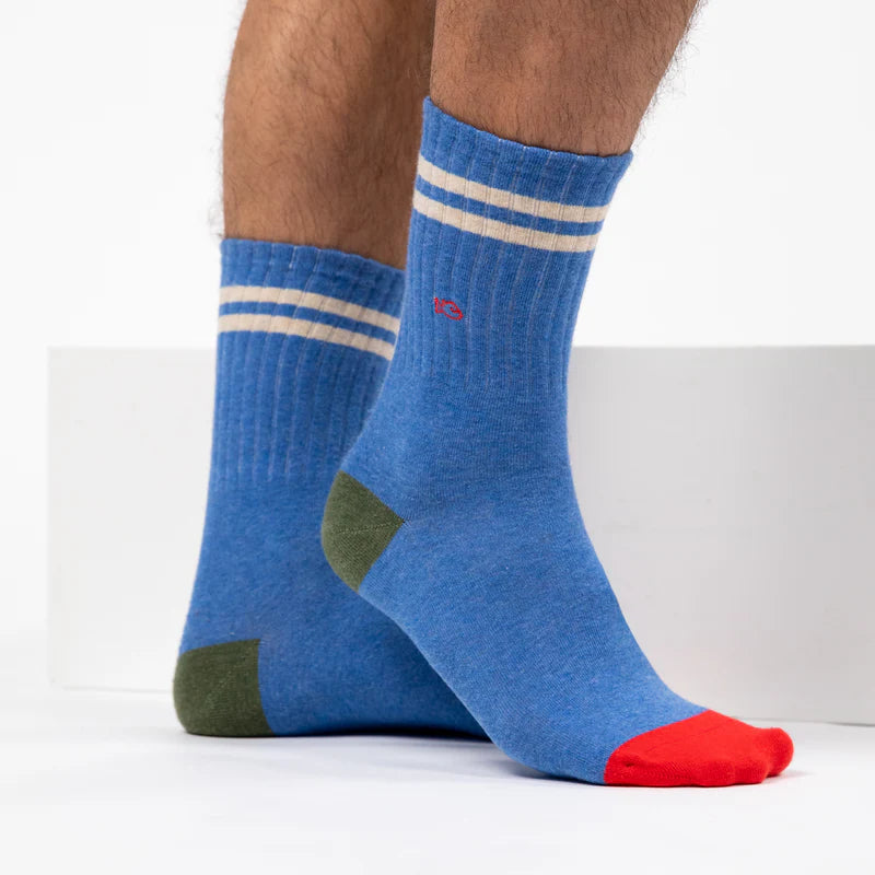 Blue socks with white stripes and red toes on a white background