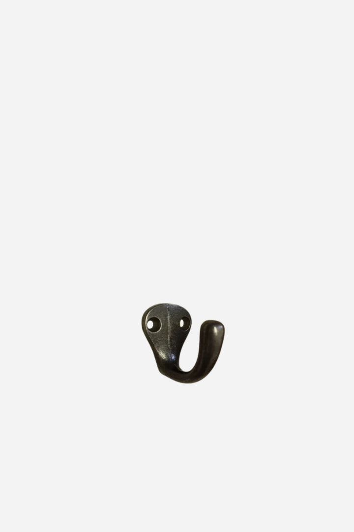 Bronze-colored metal hook on a white background