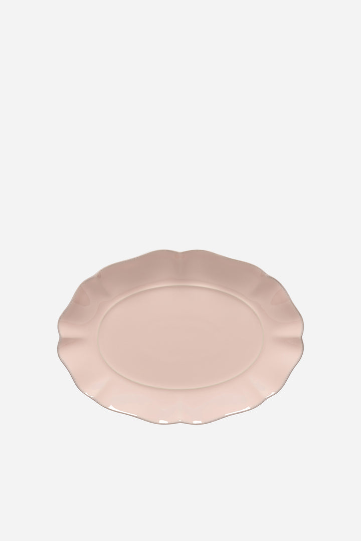 Pink ceramic plate on a white background