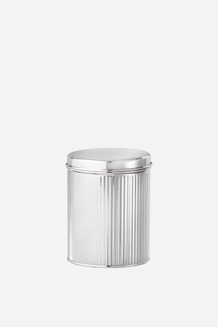 Silver cylindrical container with a ribbed texture on a white background