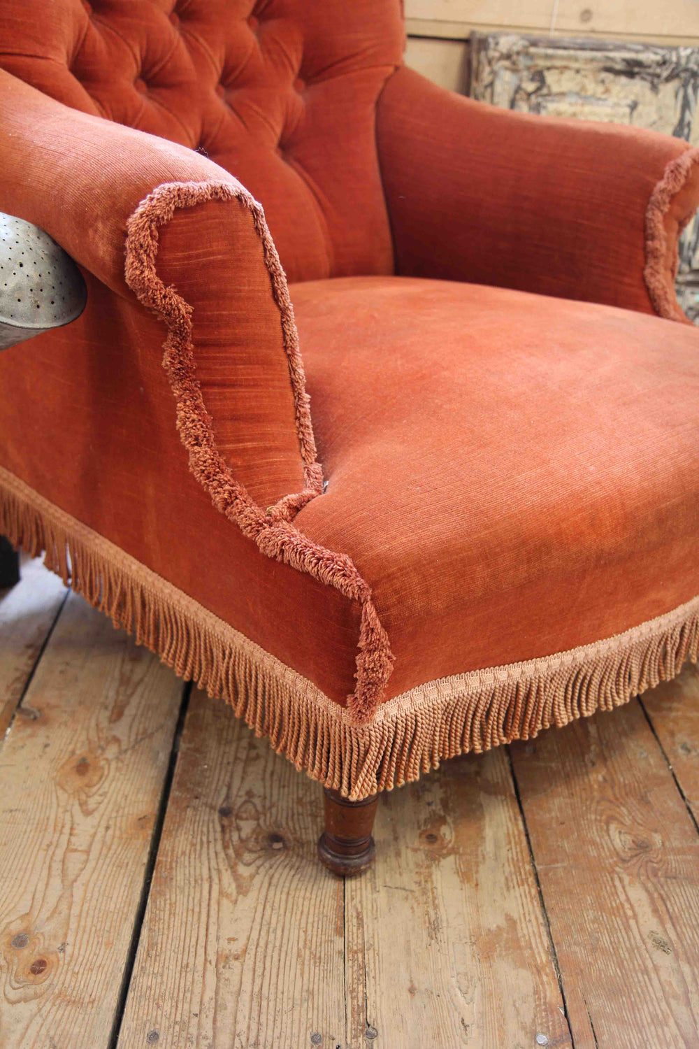 rust velvet armchair with fringing