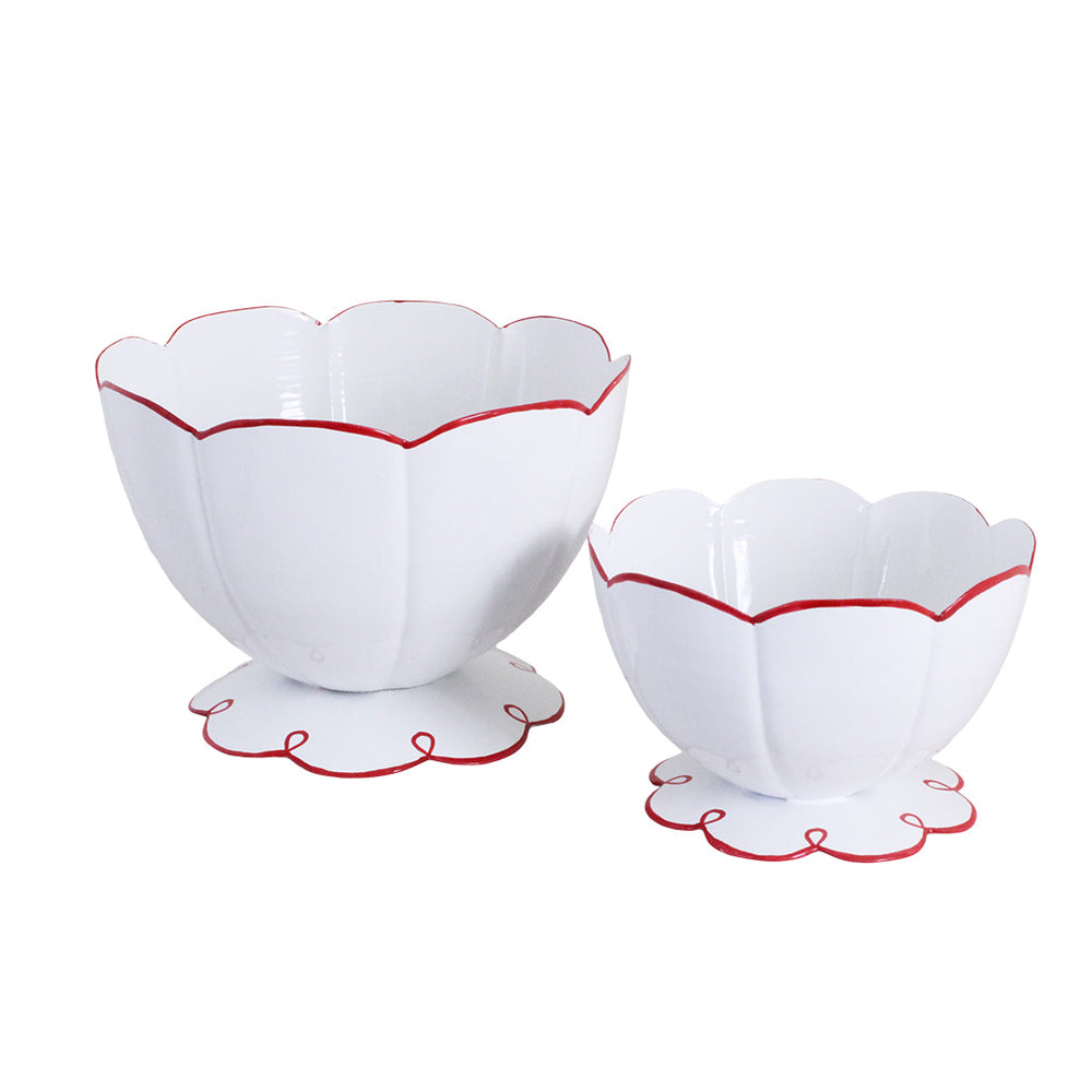 Two white bowls with red rims on a white background