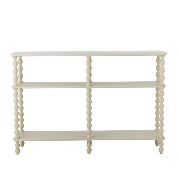 White decorative console table with spool legs on a white background